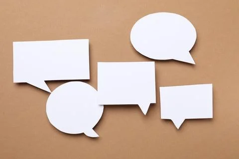 Blank speech bubbles on brown background. Space for text Stock Photos