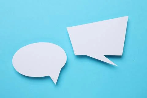 Blank speech bubbles on light blue background. Space for text Stock Photos