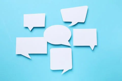 Blank speech bubbles on light blue background. Space for text Stock Photos