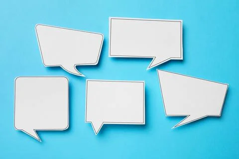 Blank speech bubbles on light blue background, top view. Space for text Stock Photos