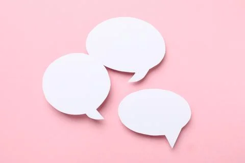 Blank speech bubbles on light pink background. Space for text Stock Photos