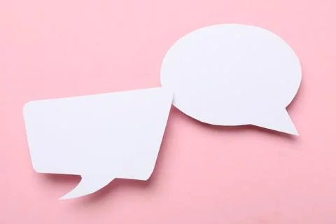 Blank speech bubbles on light pink background. Space for text Stock Photos