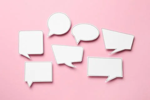 Blank speech bubbles on light pink background, top view. Space for text Stock Photos