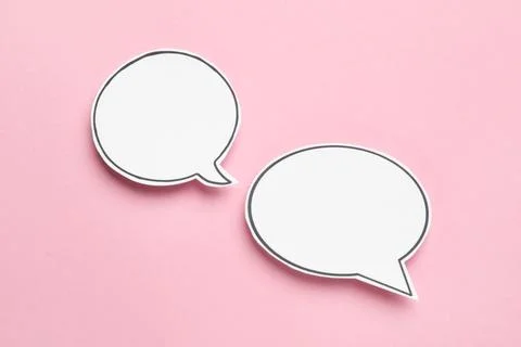 Blank speech bubbles on light pink background. Space for text Stock Photos