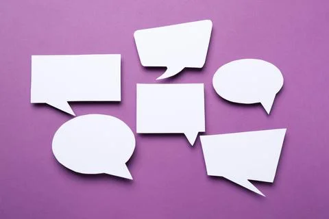 Blank speech bubbles on purple background. Space for text Stock Photos