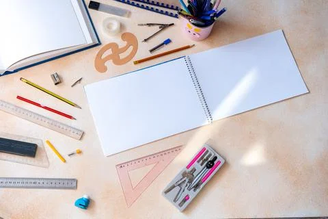 Blank spiral notebook with geometry drafting tools background. Various draw.. Stock Photos