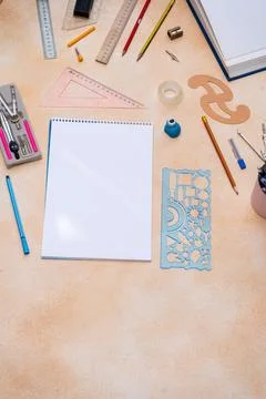 Blank spiral notebook with geometry drafting tools background. Various draw.. Stock Photos