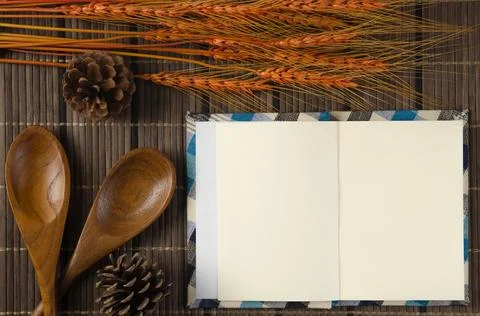Blank spiral notepad notebook on brown bamboo background Stock Photos
