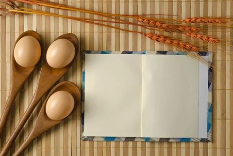 Blank spiral notepad notebook on brown bamboo background Fotos Stock