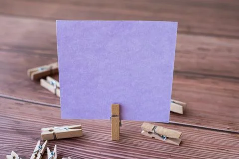 Blank Square Note Surrounded By Laundry Clips Showing New Meaning. Empty Piece Foto stock