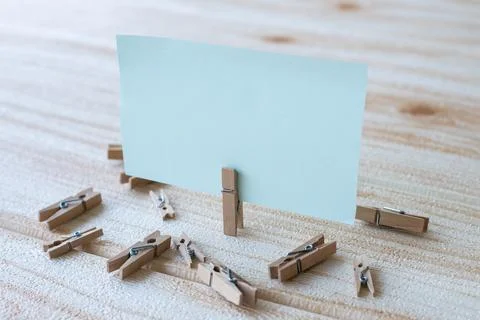 Blank Square Note Surrounded By Laundry Clips Showing New Meaning. Empty Pi.. Stock Photos