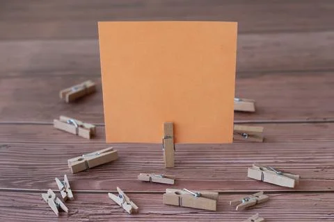 Blank Square Note Surrounded By Laundry Clips Showing New Meaning. Empty Pi.. Stock Photos