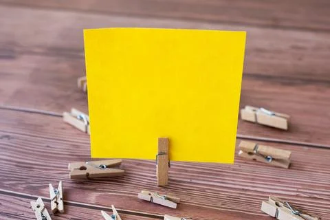 Blank Square Note Surrounded By Laundry Clips Showing New Meaning. Empty Pi.. Stock Photos