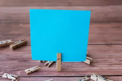 Blank Square Note Surrounded By Laundry Clips Showing New Meaning. Empty Pi.. Stock Photos