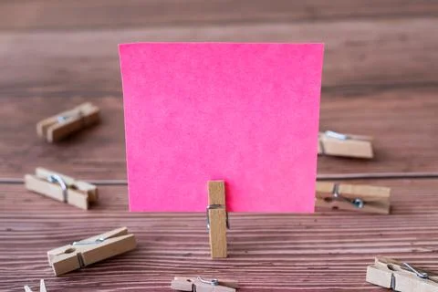 Blank Square Note Surrounded By Laundry Clips Showing New Meaning. Empty Pi.. Stock Photos