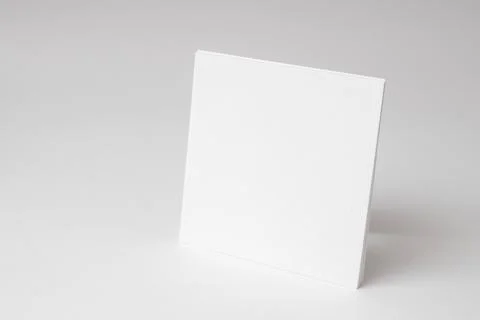 A blank square white empty paper on white background Stock Photos
