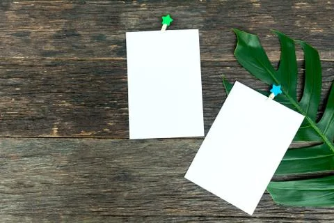 Blank squared notepad pages and the paper clip. Note paper stuck with paper c Stock Photos