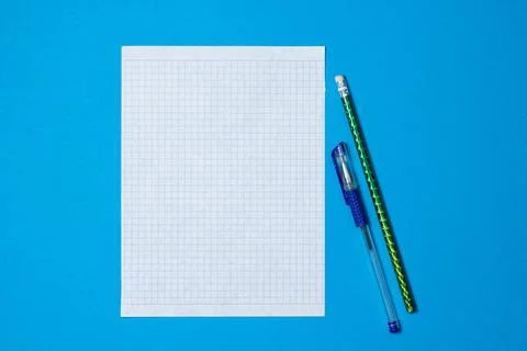 Blank squared paper for copy space on a blue background Stock Photos
