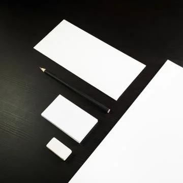 Blank stationery on black Stock Photos
