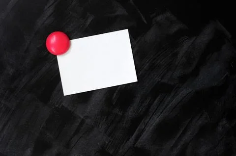 Blank stick note on a blackboard 스톡 사진