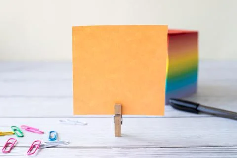 Blank Sticky Note With Laundry Clip Stack Of Colorful Paper Pen Placed On Table Stock Photos