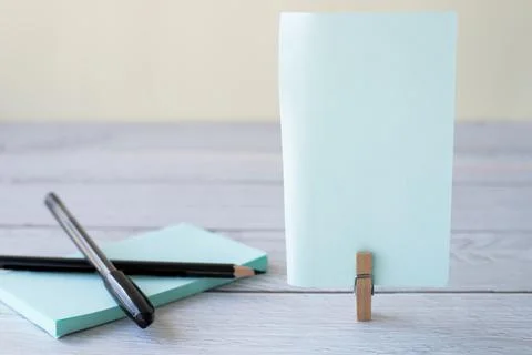 Blank Sticky Note With Laundry Clip Stack Of Colorful Paper Pen Placed On T.. Stock Photos