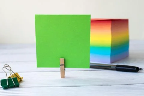 Blank Sticky Note With Laundry Clip Stack Of Colorful Paper Pen Placed On T.. Stock Photos