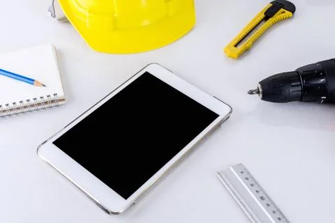 Blank tablet with Engineer construction accessories. Stockfoto's