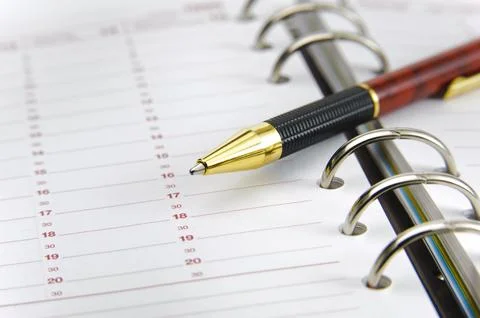 Blank time planner with pen Stock Photos