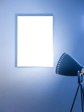 Blank vertical poster in a frame on the wall Stock Photos
