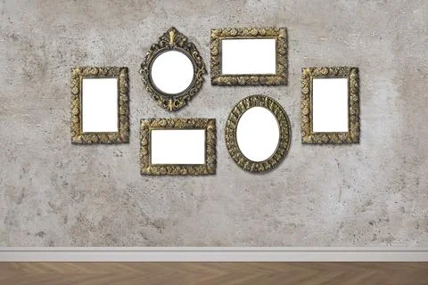 Blank vintage frames hanging on gray textured wall. Mockup for design 스톡 사진
