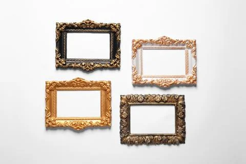 Blank vintage frames hanging on white wall Stock Photos