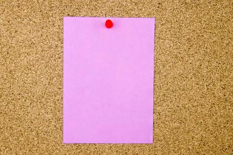Blank violet paper note pinned on cork board Stock Photos