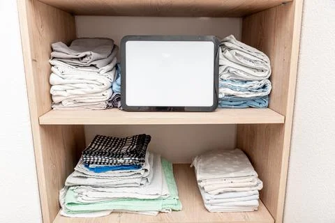Blank white board notebook with copy space on sheets shelf wardrobe backgroun Stock Photos