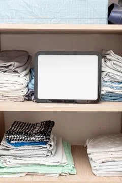 Blank white board notebook with copy space on sheets shelf wardrobe backgroun Stock Photos