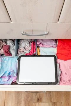 Blank white board notebook copy space on open drawer shelf wardrobe backgroun Stock Photos