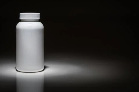 Blank White Bottle Ready For Your Text Under Spot Light. Stock Photos