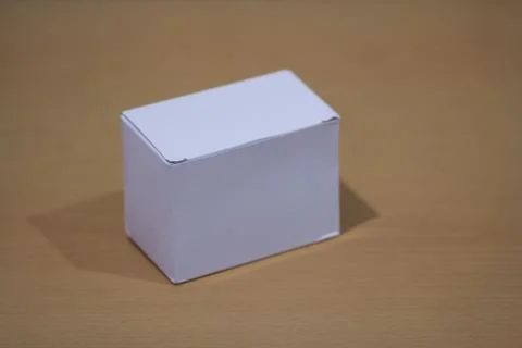 Blank white box on a table Фото