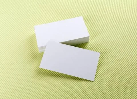 Blank white business cards A stack of business cards on a green background... Foto stock