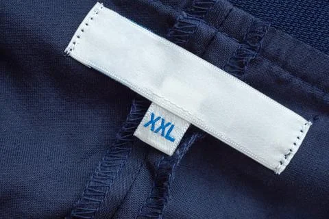 Blank white clothes label close up Stock Photos