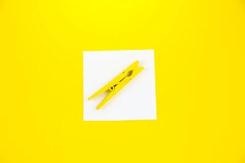 Blank white To Do List Sticker with yellow wooden clothespin. Close up of r.. Stock Photos