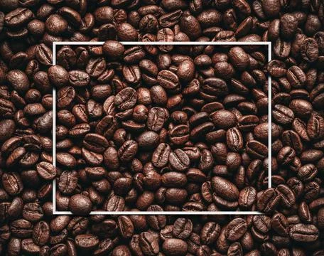 Blank white frame in the roasted coffee beans Stock Photos