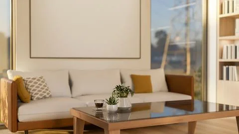 Blank white frame on wall between two glass doors of a living room with woo.. Illustrazione stock