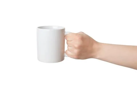 Blank white mug, held by an isolated hand, offers endless possibilities Foto stock