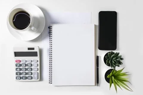 Blank white notebook with empty space in the middle. On the white table are.. Stock Illustration