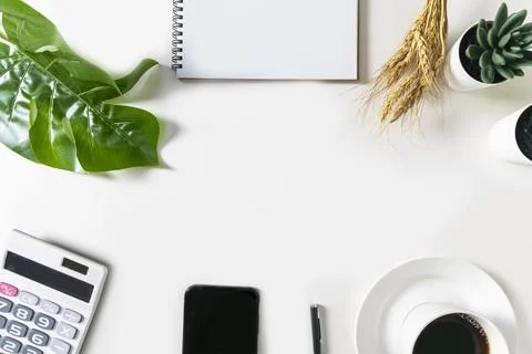 Blank white notebook with empty space in the middle. On the white table are.. Stock Illustration