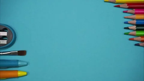 Blank white page of diary surrounded by colorful school stationery. Stop motion Stock Footage 248383221