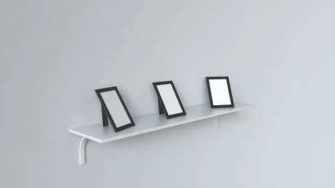 Blank white photo frames standing on shelf Illustrazione stock