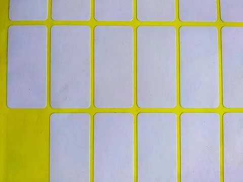 Blank white rectangular adhesive stickers sheet with missing label Stock-Fotos