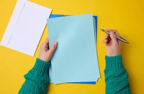 Blank white sheets and two female hands, top view. Text writing, list Stock Photos